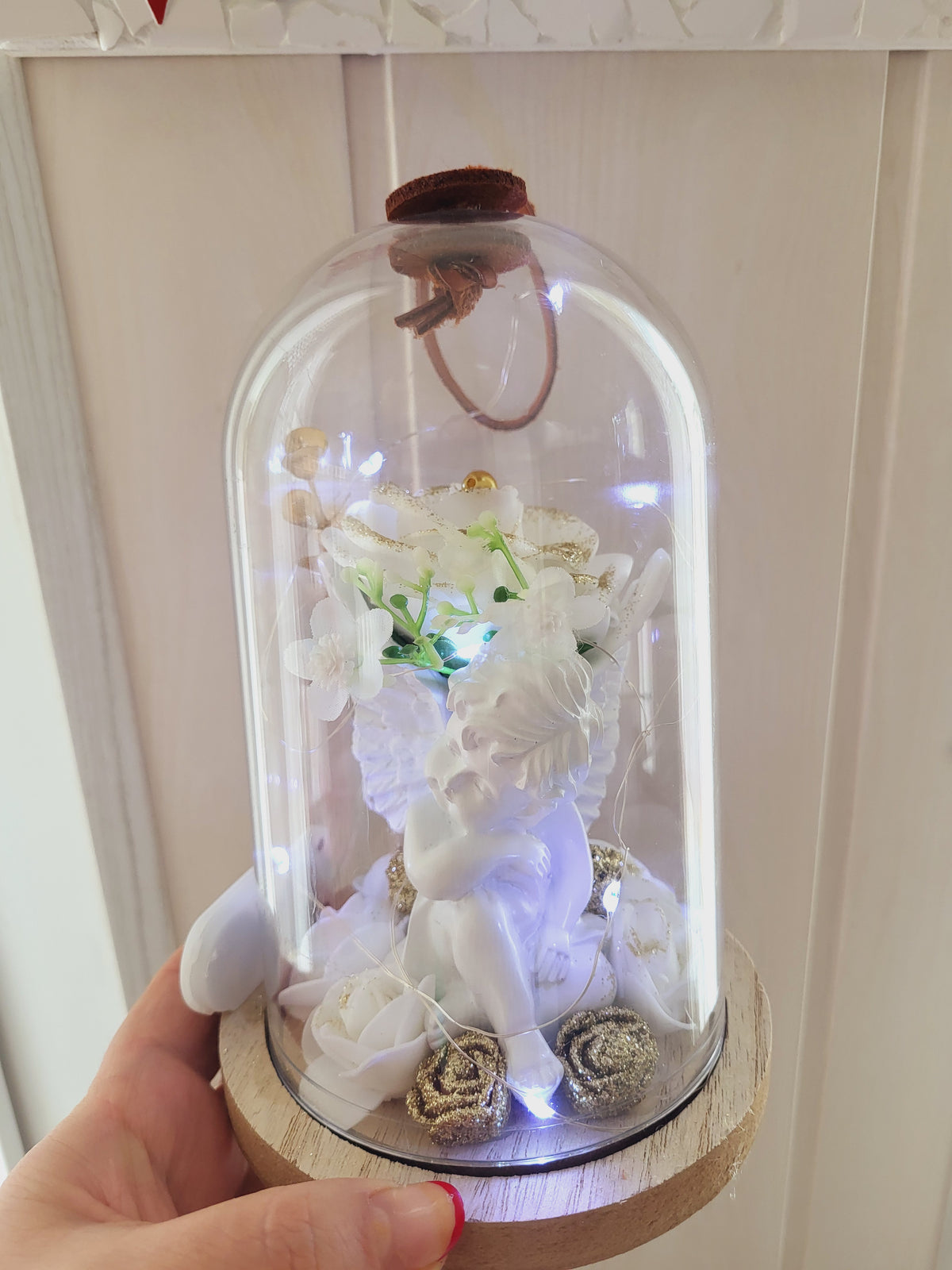 Cloche avec un ange pour l'intérieur