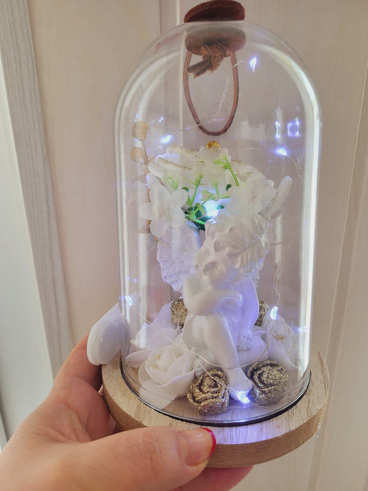 Cloche avec un ange pour l'intérieur